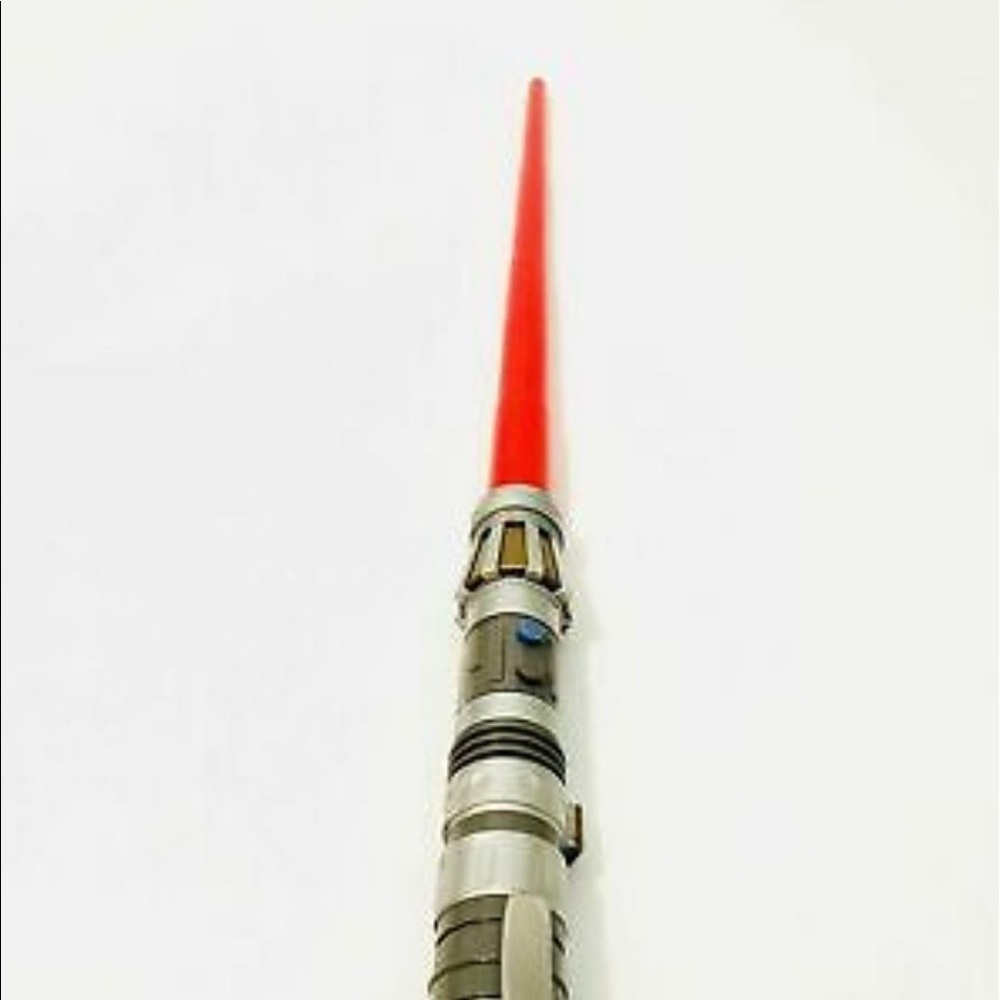 Red lightsaber toy.